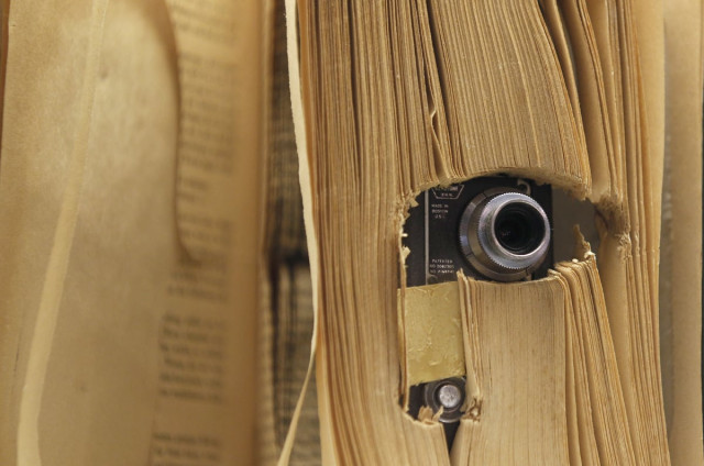 a small photo camera placed in a book and used by the u s central intelligence agency cia is displayed at the 039 top secret 039 spy museum in oberhausen july 10 2013 photo reuters