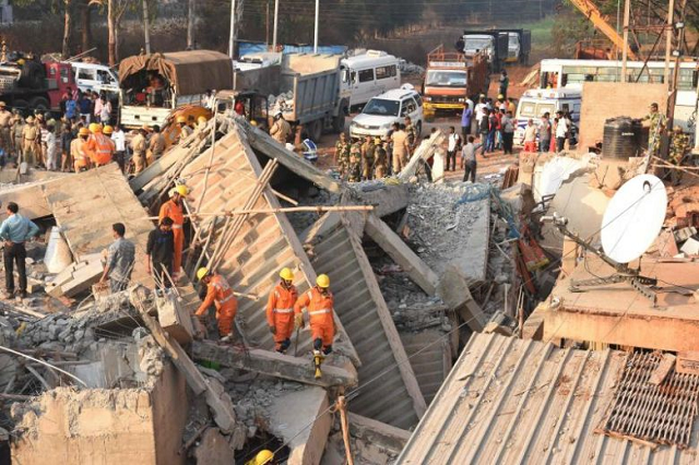 rescuers searching for survivors on march 20 2019 after a building collapsed in the dharwad district of karnataka photo afp