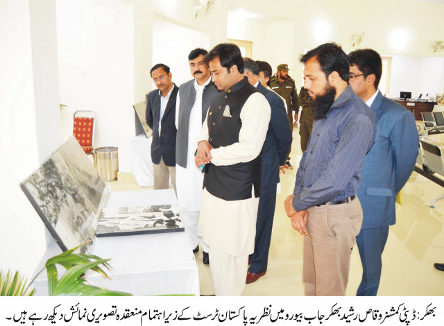 visitors take keen interest in photos displayed at the exhibition photo express visitors take keen interest in photos displayed at the exhibition photo express