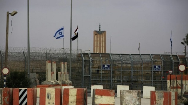 israeli and egyptian flags seen at the nitzana border crossing along their border near the israeli village of nitzanei sinai photo afp