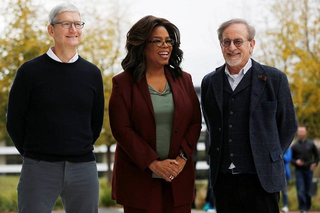 apple ceo tim cook oprah winfrey and director steven spielberg stand for a photo after the apple special event at the steve jobs theater in cupertino california us march 25 2019 photo reuters apple ceo tim cook oprah winfrey and director steven spielberg stand for a photo after the apple special event at the steve jobs theater in cupertino california us march 25 2019 photo reuters