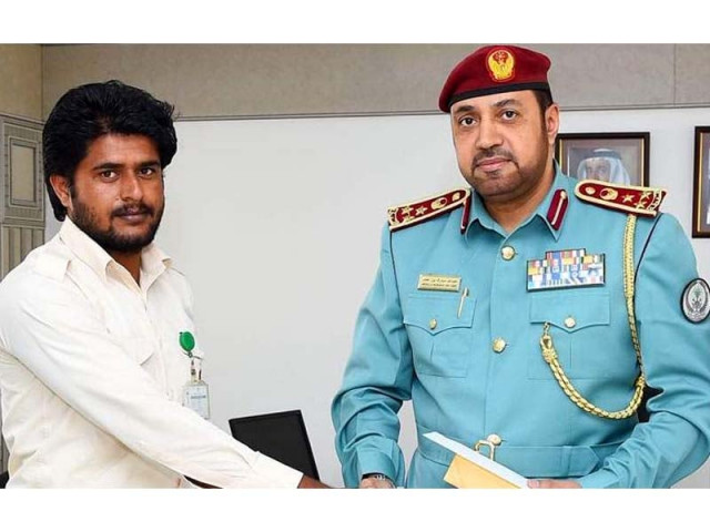 muzaffar hussain nathar with the police official photo courtesy khaleej times muzaffar hussain nathar with the police official photo courtesy khaleej times