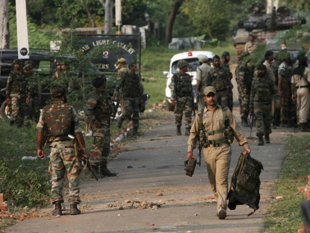 indian troops can be seen at the site of pulwama attack in iok on february 14 photo reuters file