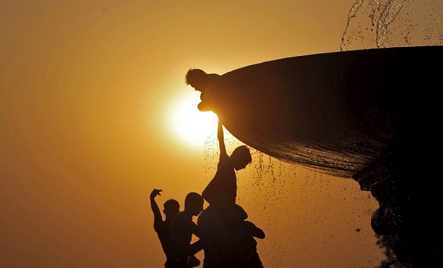 children playing under the hot sun photo reuters