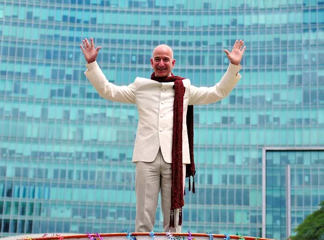 jeff bezos founder and chief executive officer of amazon poses as he stands atop a supply truck during a photo opportunity at the premises of a shopping mall in bangalore india september 28 2014 photo reuters jeff bezos founder and chief executive officer of amazon poses as he stands atop a supply truck during a photo opportunity at the premises of a shopping mall in bangalore india september 28 2014 photo reuters