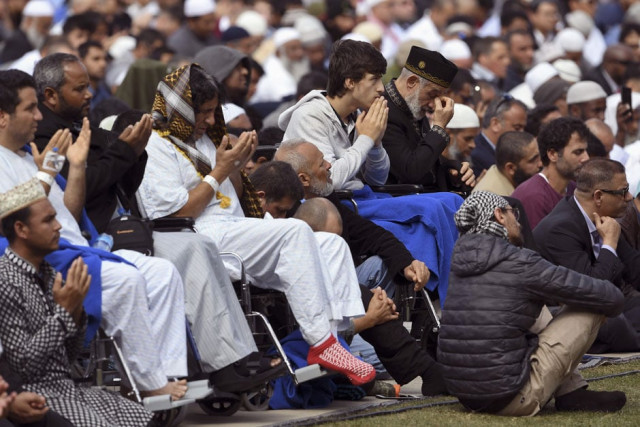 injured people from the shootings pray during congregational friday prayers and two minutes of silence for victims of the twin mosque massacre at hagley park in christchurch photo afp injured people from the shootings pray during congregational friday prayers and two minutes of silence for victims of the twin mosque massacre at hagley park in christchurch photo afp
