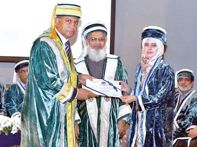 pof board chairman presenting a certificate to dr farhana kausar the best graduate of session 2013 2018 at the 9th convocation of wah medical college photo express