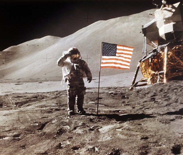 apollo 15 lunar module pilot james b irwin salutes while standing beside the fourth american flag planted on the surface of the moon on tuesday march 26 2019 vice president mike pence called for landing astronauts on the moon within five years photo nasa