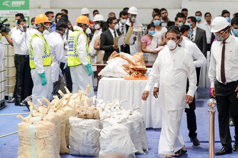 sri lankan president maithripala sirisena watches as sri lankan police personnel prepare seized cocaine to be destroyed photo afp