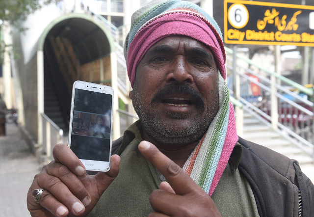 muhammad riaz father of 16 year old uzma a maid who was found dumped in a city canal shows her picture on a smartphone photo afp muhammad riaz father of 16 year old uzma a maid who was found dumped in a city canal shows her picture on a smartphone photo afp