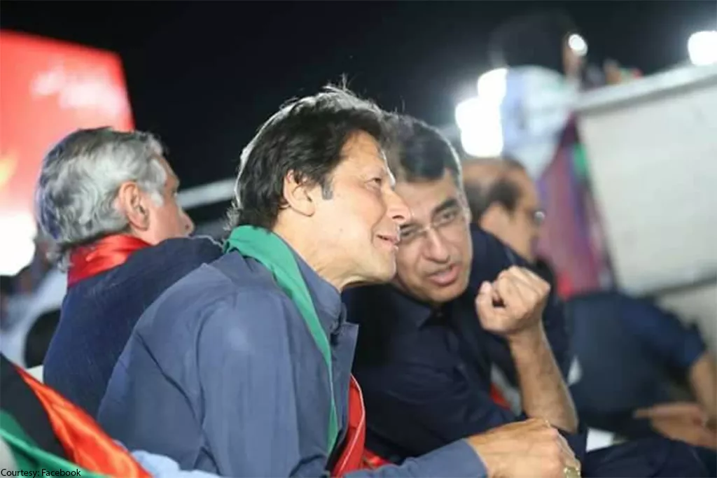 pm imran khan listens as finance minister asad umar speaks photo pti pm imran khan listens as finance minister asad umar speaks photo pti