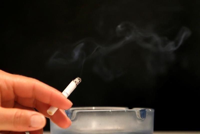 an individual smokes a cigarette in this representational image photo reuters