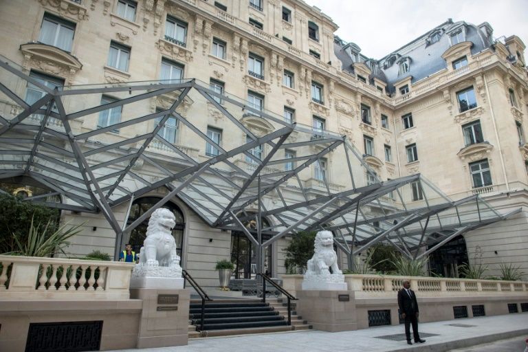 thieves smashed display cases holding jewels and clothing at the peninsula hotel in paris while holding employees at gunpoint photo afp