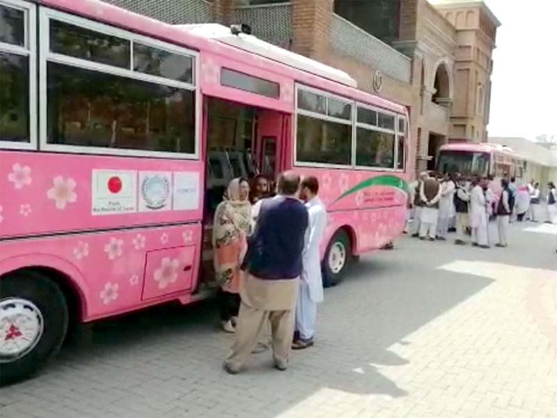 guests look at a pink bus during the launching ceremony on thursday in mardan photos express