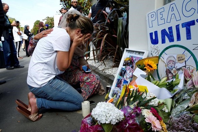 a woman reacts at a make shift memorial outside the al noor mosque in christchurch new zealand march 23 2019 photo reuters