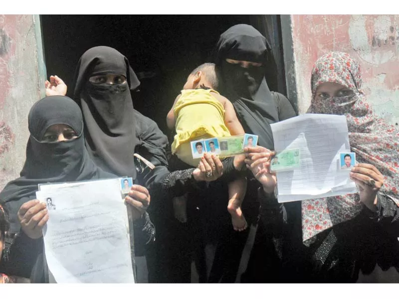family members of pakistani fishermen who are imprisoned in indian jails hold up pictures of their loved ones seeking the government s help in securing their safe return photo ppi family members of pakistani fishermen who are imprisoned in indian jails hold up pictures of their loved ones seeking the government s help in securing their safe return photo ppi