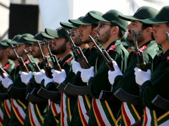 iranian soldiers from the revolutionary guards march march at a military parade in tehran photo afp