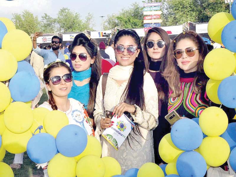 people enjoy different activities at the europe day celebrations at the pnca in islamabad photos app inp