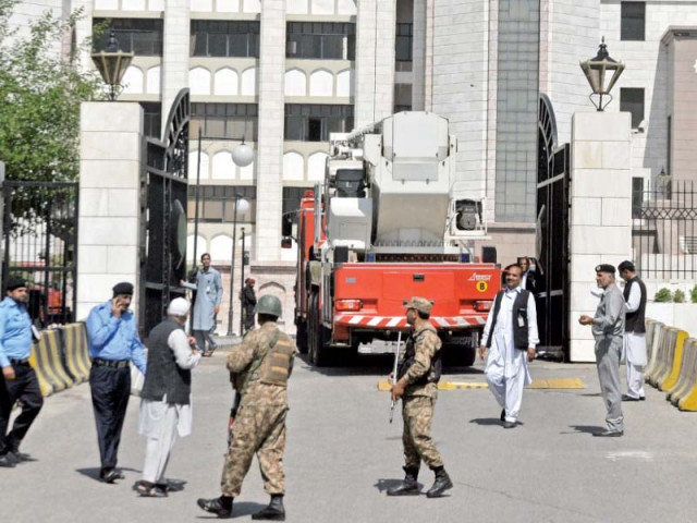 emergency rescue services and security personnel respond to a fire alert at the prime minister s secretariat photo zafar aslam express