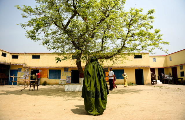 an indian voter stands after casting her vote at a polling station during india 039 s general election in shahpur near muzaffarrnagar in the northern indian state of uttar pradesh on april 11 2019 photo afp
