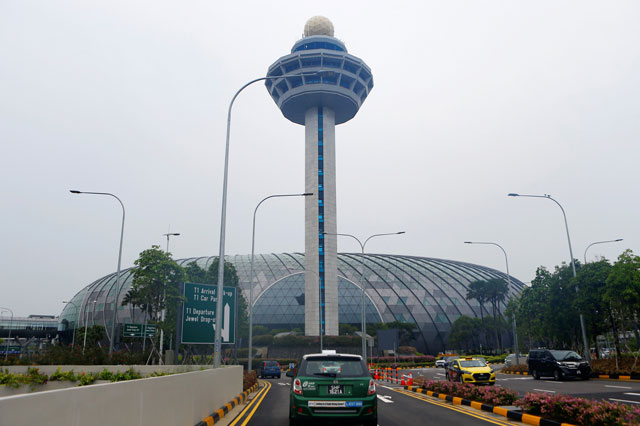 the facade of jewel and the control tower of changi airport are seen in singapore april 11 2019 photo reuters