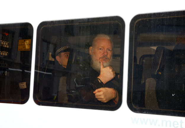 wikileaks founder julian assange is seen in a police van after was arrested by british police outside the ecuadorian embassy in london on thursday photo reuters