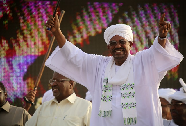 sudan 039 s president omar al bashir and then presidential candidate of the ruling national congress party ncp waves in the capital khartoum photo afp