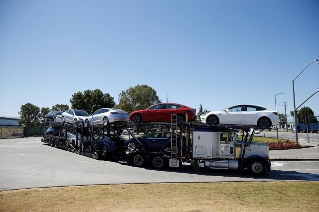 a car carrier trailer carries tesla model 3 electric sedans is seen outside the tesla factory in fremont california us june 22 2018 photo reuters a car carrier trailer carries tesla model 3 electric sedans is seen outside the tesla factory in fremont california us june 22 2018 photo reuters
