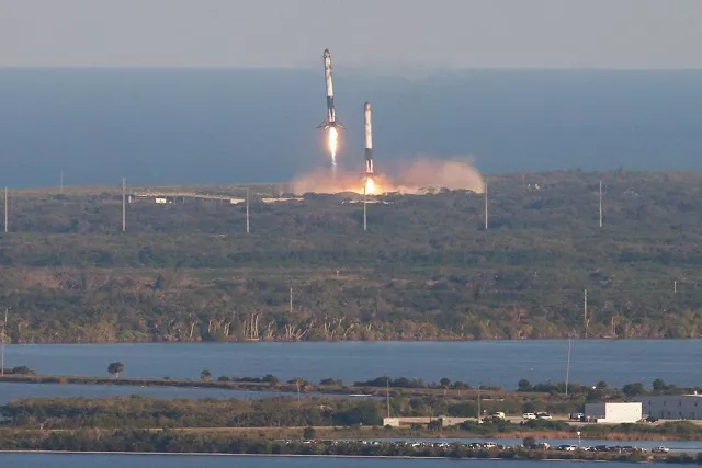 roughly three minutes after clearing the pad heavy s two side boosters separated from the core rocket for a synchronised landing at the cape canaveral air force station photo reuters roughly three minutes after clearing the pad heavy s two side boosters separated from the core rocket for a synchronised landing at the cape canaveral air force station photo reuters