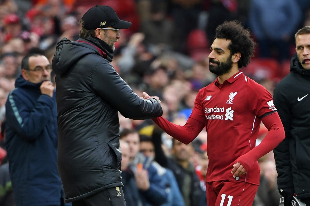 apt reply liverpool rose to the challenge as mane 039 s opener and a blistering long range drive from salah moved them two points clear of second placed city photo afp