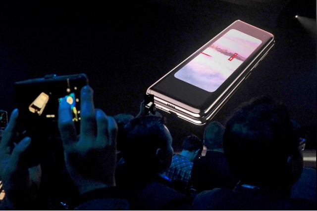 the samsung galaxy fold phone is shown on a screen at samsung s unpacked event in san francisco california us february 20 2019 photo reuters