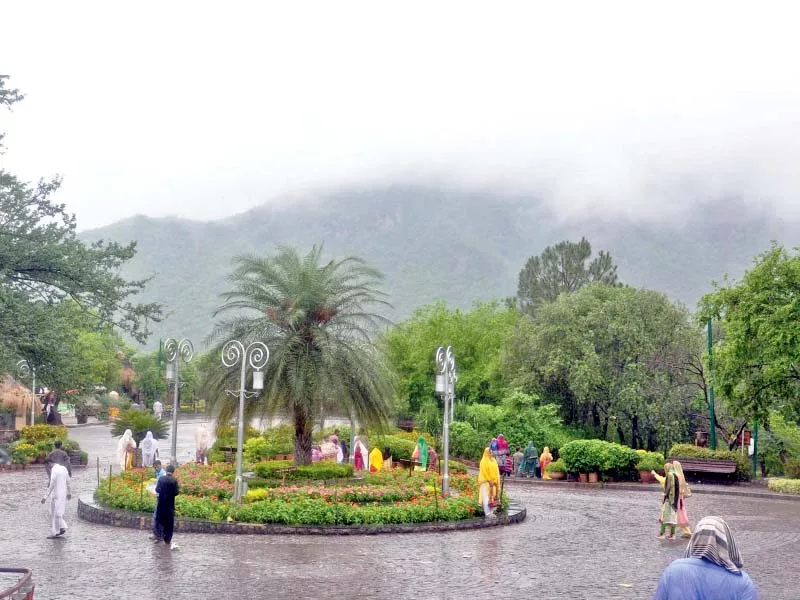 visitors enjoy the wet spell at daman e koh in the capital photo inp visitors enjoy the wet spell at daman e koh in the capital photo inp