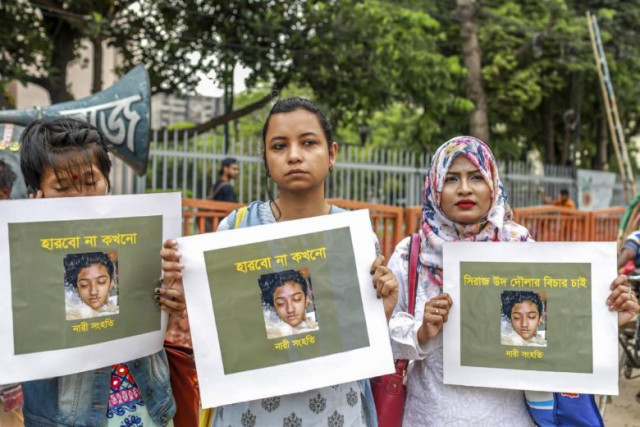 bangladeshi women hold placards and photographs of schoolgirl nusrat jahan rafi at a protest in dhaka photo afp bangladeshi women hold placards and photographs of schoolgirl nusrat jahan rafi at a protest in dhaka photo afp