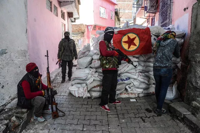 a kurdish workers party pkk flag hangs on a barricade in the sur district of diyarbakir southeastern turkey on november 18 2015 photo afp a kurdish workers party pkk flag hangs on a barricade in the sur district of diyarbakir southeastern turkey on november 18 2015 photo afp