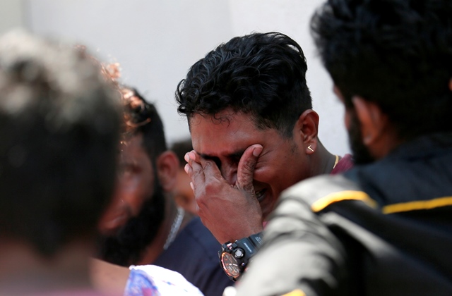 a relative of a victim of the explosion at st anthony 039 s shrine kochchikade church reacts at the police mortuary in colombo photo reuters