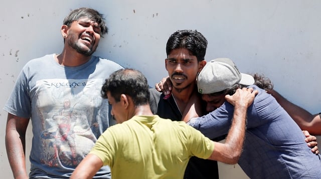 people mourn for their loved ones outside a hospital in colombo sri lanka photo reuters