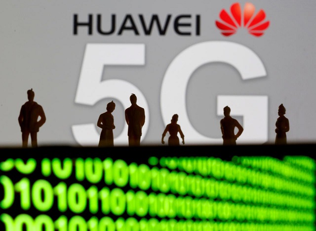 small toy figures are seen in front of a displayed huawei and 5g network logo in this illustration picture march 30 2019 photo reuters