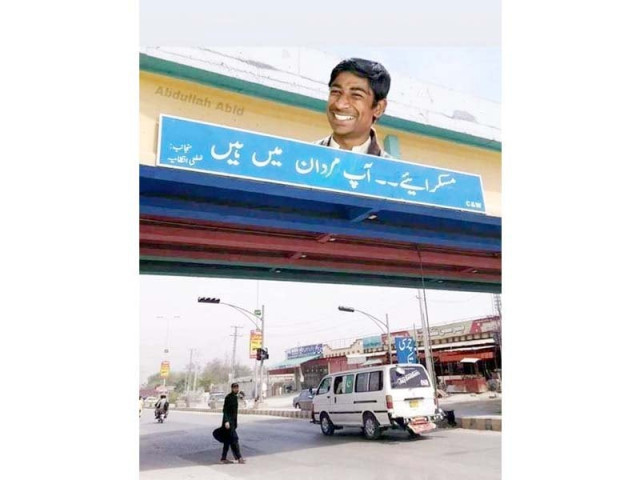 farman kaskar on billboard in mardan photo express farman kaskar on billboard in mardan photo express