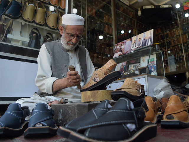 in this picture taken on april 1 2019 chacha noor din the owner of a string of shoe stores makes a pair of sandals at his shop in peshawar famed for luxury red soled stilettos french shoe designer christian louboutin has taken inspiration for a new sandal from pakistan 039 s tribal frontier sparking claims of cultural appropriation along with grins from grizzled pakistani cobblers photo by abdul majeed afp in this picture taken on april 1 2019 chacha noor din the owner of a string of shoe stores makes a pair of sandals at his shop in peshawar famed for luxury red soled stilettos french shoe designer christian louboutin has taken inspiration for a new sandal from pakistan 039 s tribal frontier sparking claims of cultural appropriation along with grins from grizzled pakistani cobblers photo by abdul majeed afp