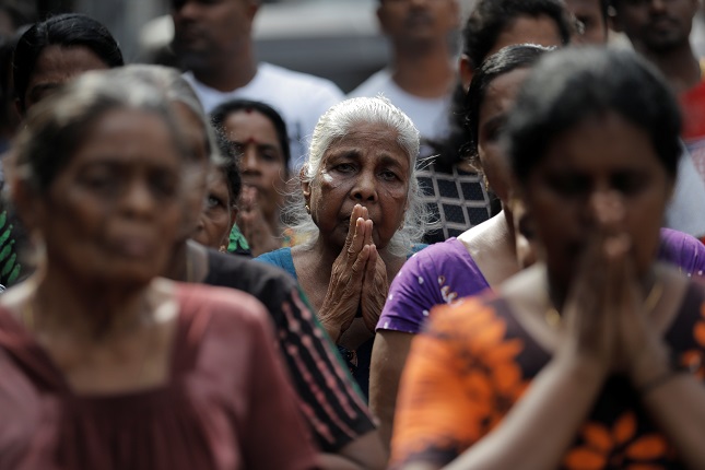 people react as silence is observed as a tribute to victims two days after a string of suicide bomb attacks on churches and luxury hotels across the island on easter sunday during a memorial service in colombo sri lanka april 23 2019 photo reuters