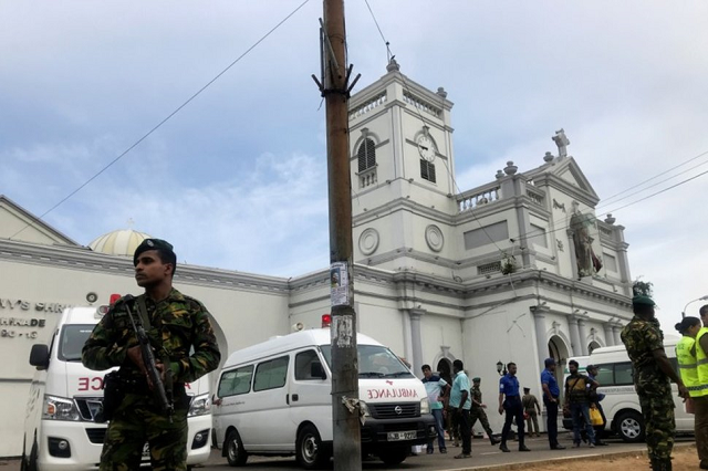 sri lankan military officials stand guard in front of the st anthony 039 s shrine kochchikade church after an explosion in colombo sri lanka april 21 2019 photo reuters