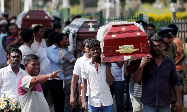 coffins of victims are carried during a mass for victims two days after a string of suicide bomb attacks on churches and luxury hotels across the island on easter sunday in colombo sri lanka photo reuters