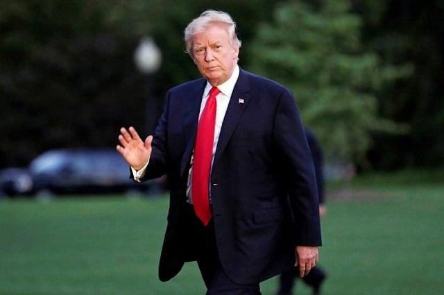 us president donald trump waves as walks on the south lawn of the white house upon his return to washington us from the g20 summit photo reuters