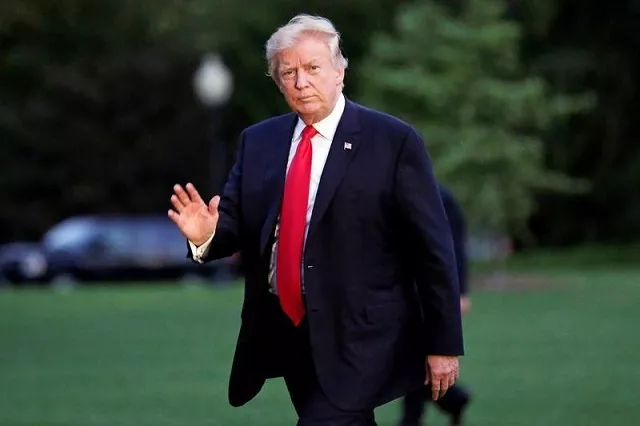 us president donald trump waves as walks on the south lawn of the white house upon his return to washington us from the g20 summit photo reuters us president donald trump waves as walks on the south lawn of the white house upon his return to washington us from the g20 summit photo reuters