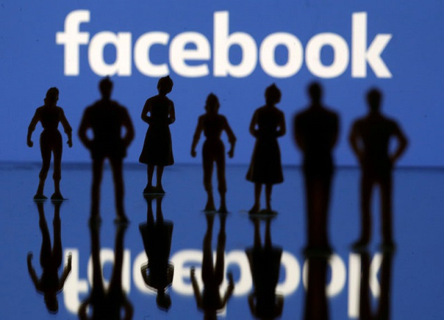 small toy figures are seen in front of facebook logo in this illustration picture april 8 2019 photo reuters