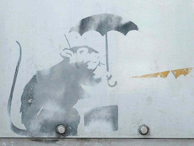 curious tokyoites tourists and art lovers are flocking to see the work depicting a rat holding an umbrella photo afp curious tokyoites tourists and art lovers are flocking to see the work depicting a rat holding an umbrella photo afp