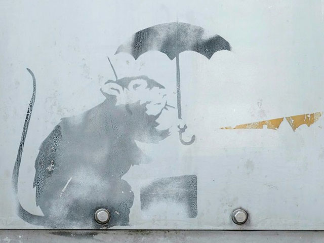 curious tokyoites tourists and art lovers are flocking to see the work depicting a rat holding an umbrella photo afp