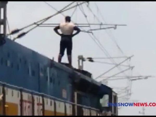 man seen standing on the train seconds before he electrocutes himself