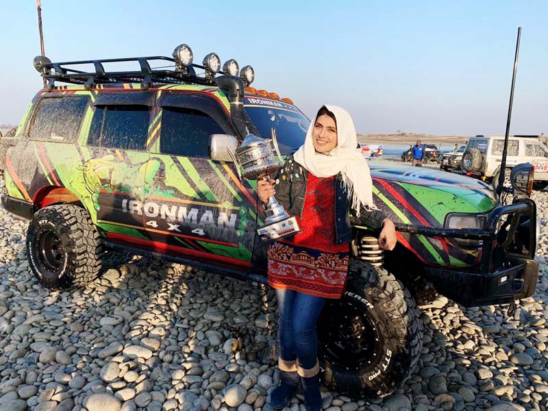 salma khan marwat with her ride and trophy after winning chakwal 4 4 challenge off road rally photo express