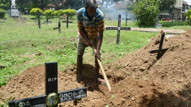 piyasri gunasena digs a grave at madampitiya cemetery in sri lanka 039 s capital colombo    he usually only digs one a day but since the easter sunday attacks he is far busier photo afp